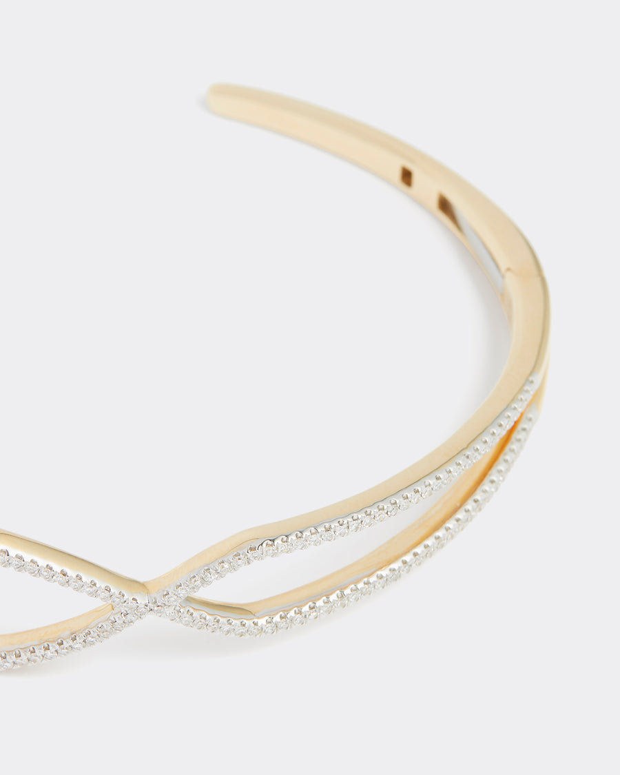 close up of geometric shaped gold and diamond bangle, product shot