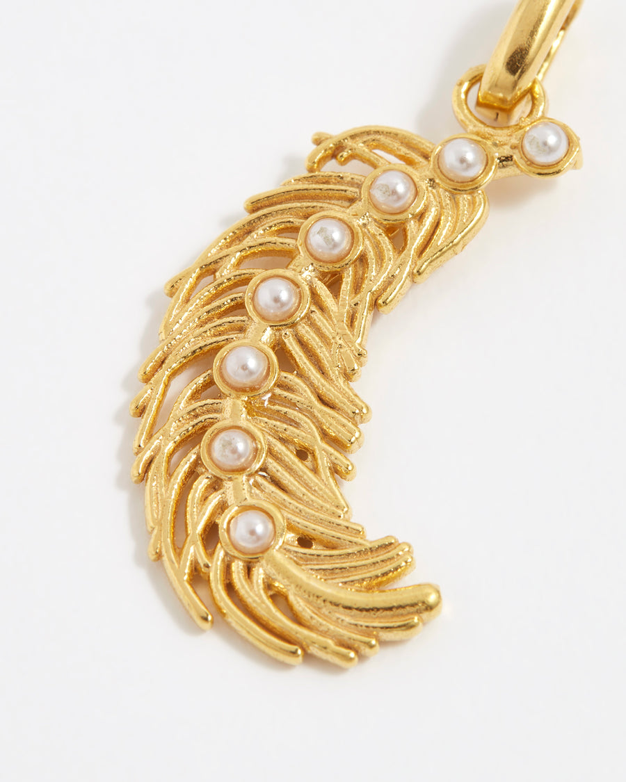 product shot of gold plated silver feather charm with pearls down the centre close up