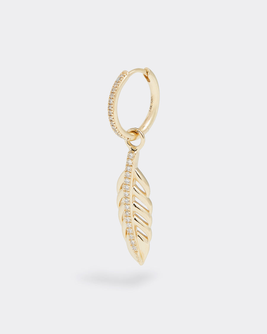 14ct gold & diamond charm, feather shape with diamonds down the centre, interchangeable charm to be used on necklaces and earrings, product shot on hoop earring