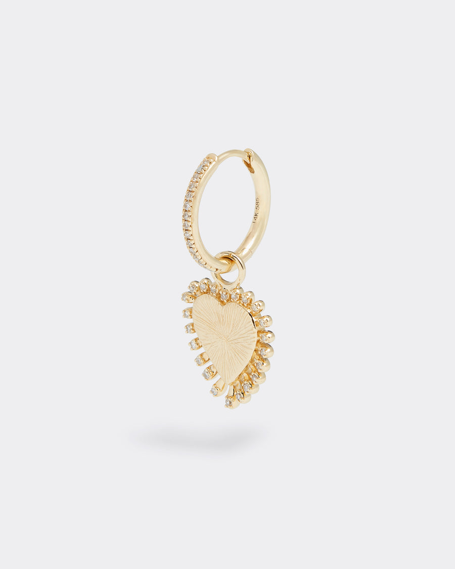 gold and diamond heart charm, product shot on an earring hoop