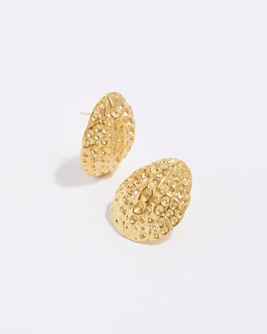 product shot of large textured gold oval oversized stud earrings