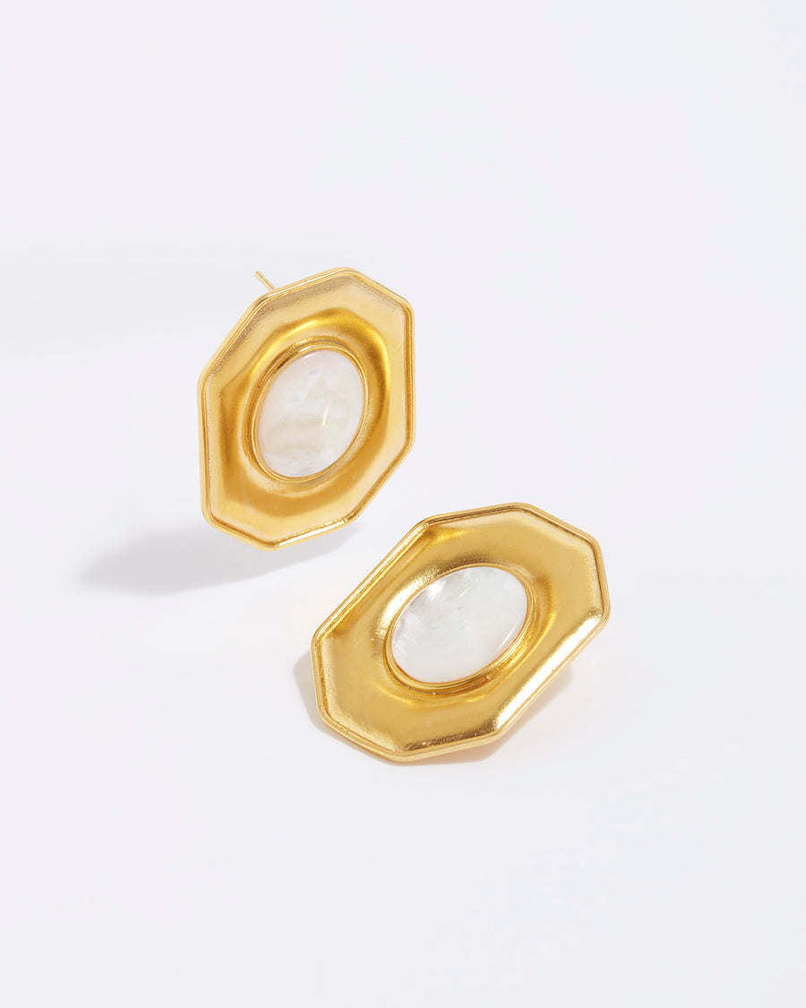product shot of oversized octagonal stud earring with oval mother of pearl centre
