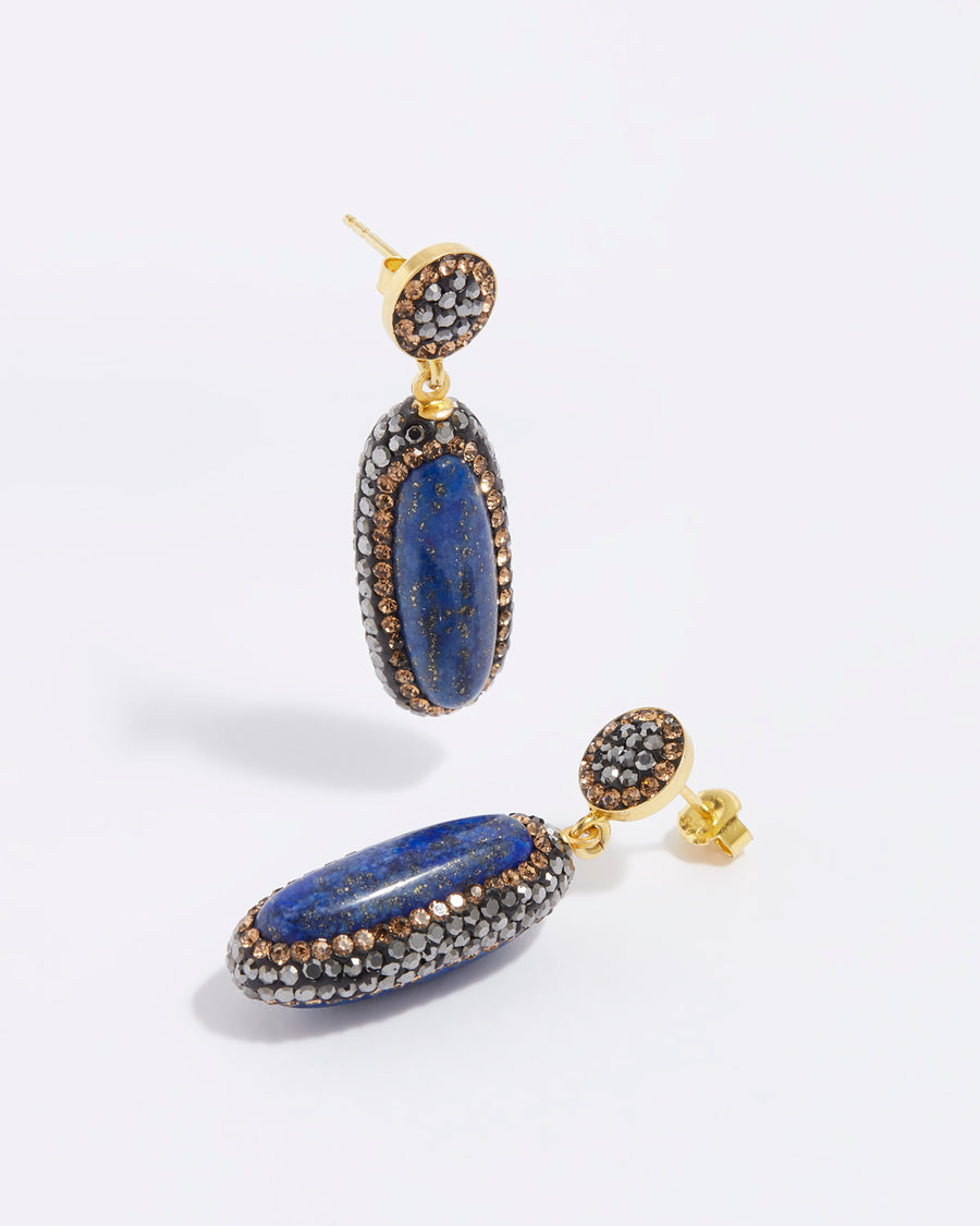 product shot of lapis long oval stone earrings surrounded by crystals
