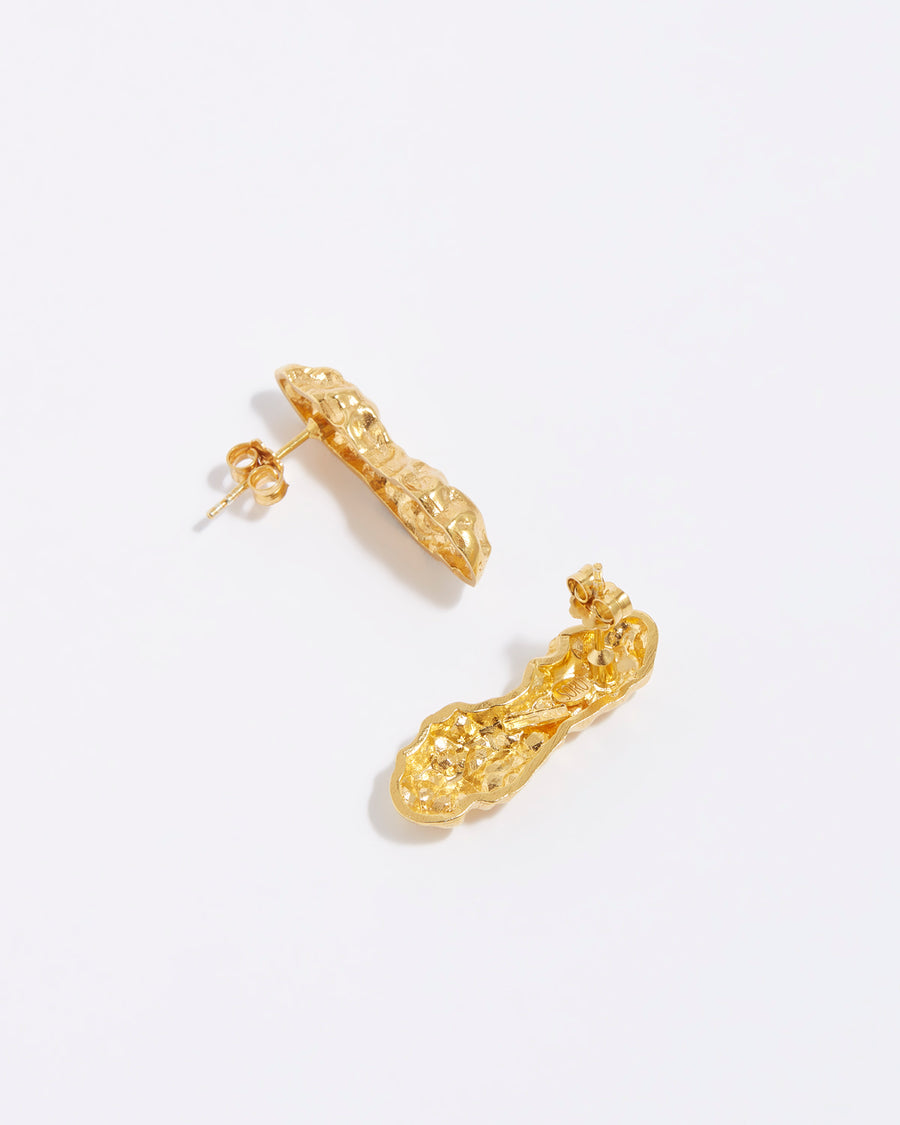 product shot of chunky, gold bar stud earrings with a bumpy, organic finish
