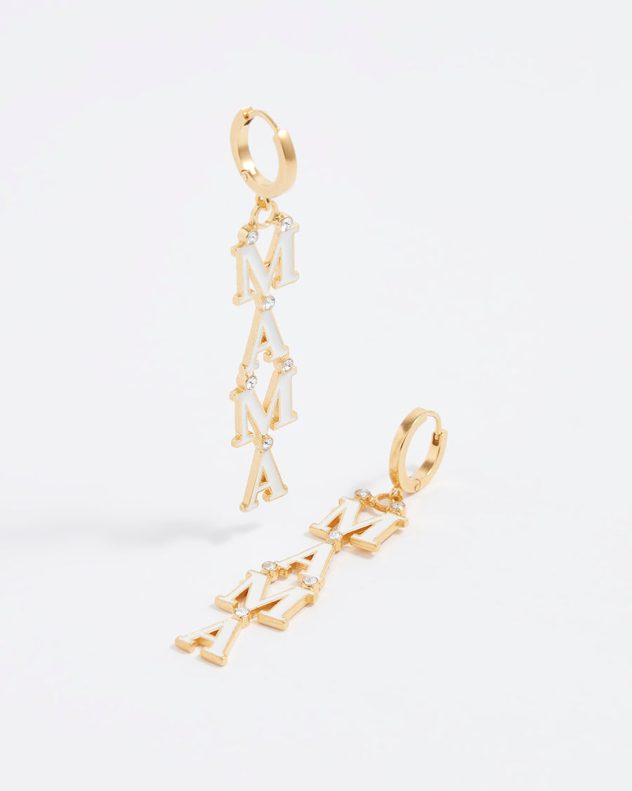 close up front image of gold and white enamel mama script earrings