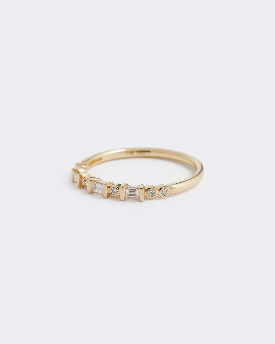 Soru Jewellery baguette and round cut diamond and gold ring, close up product shot