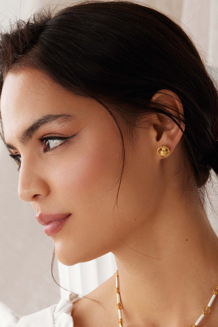 soru jewellery model shot of the gold plated silver earrings textured link stud earrings