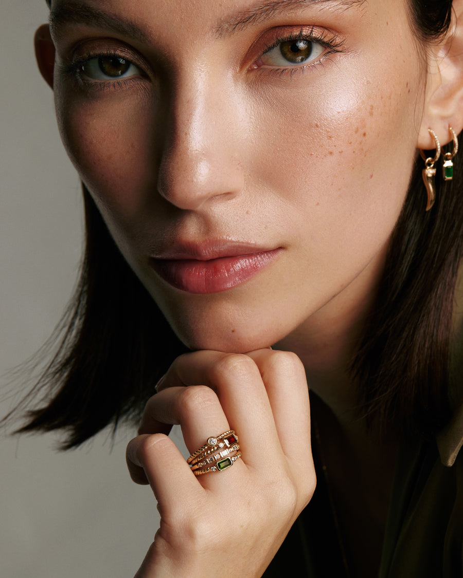 Soru Jewellery gold and diamond stacking rings shown on models hand 