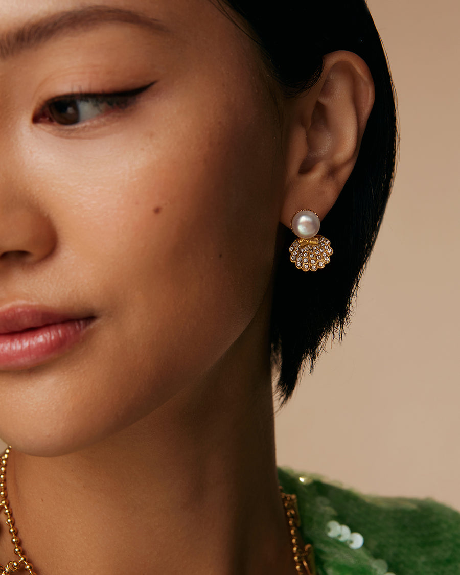 model shot of pearl stud earrings with crystal encrusted shell