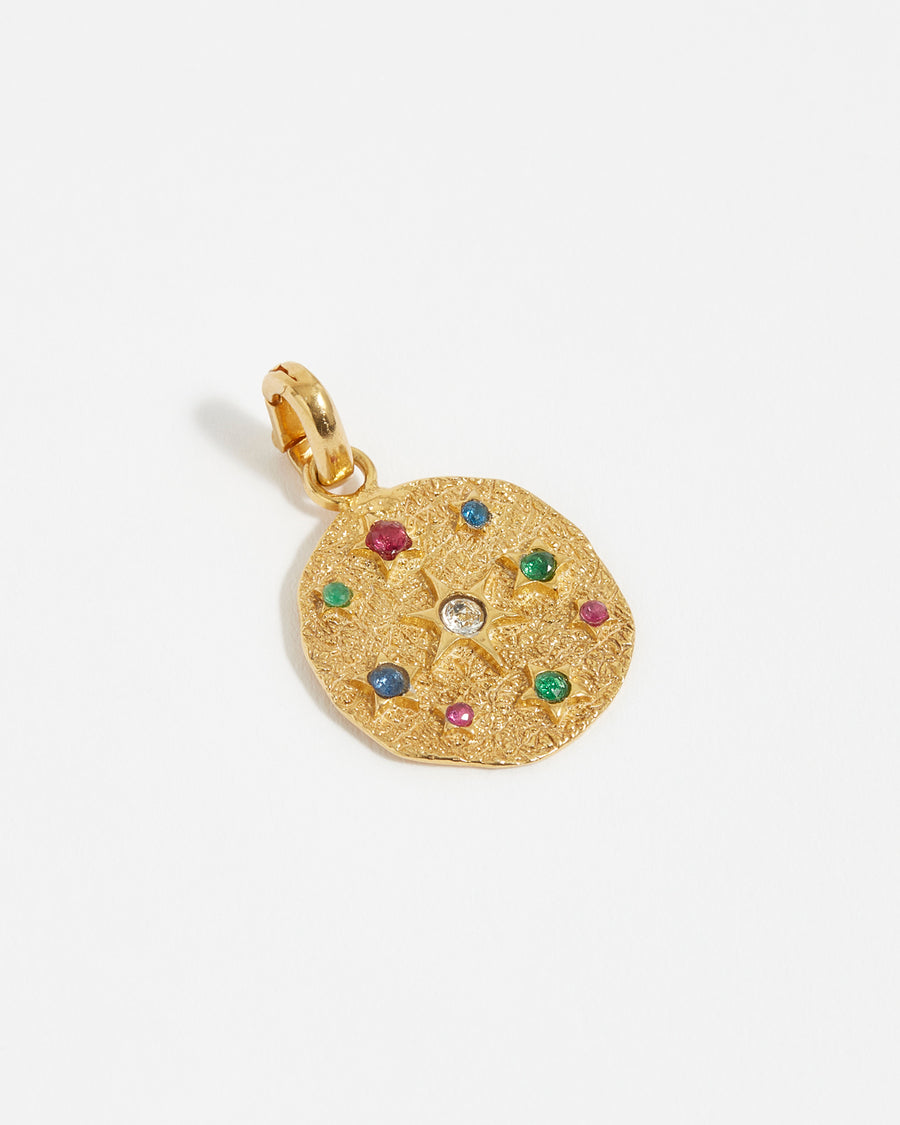 soru interchangeable circular charm with multicoloured crystal stars and an organic finish made from gold plated silver