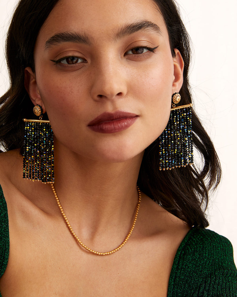 soru black crystal large sparkly earrings with strands of crystals attached to a gold bar, made with gold plated silver