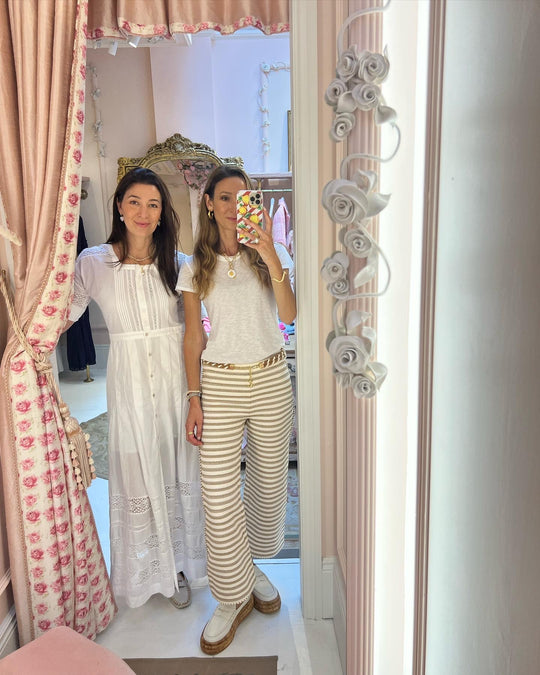 soru jewellery sisters taking a selfie in a floral print changing room