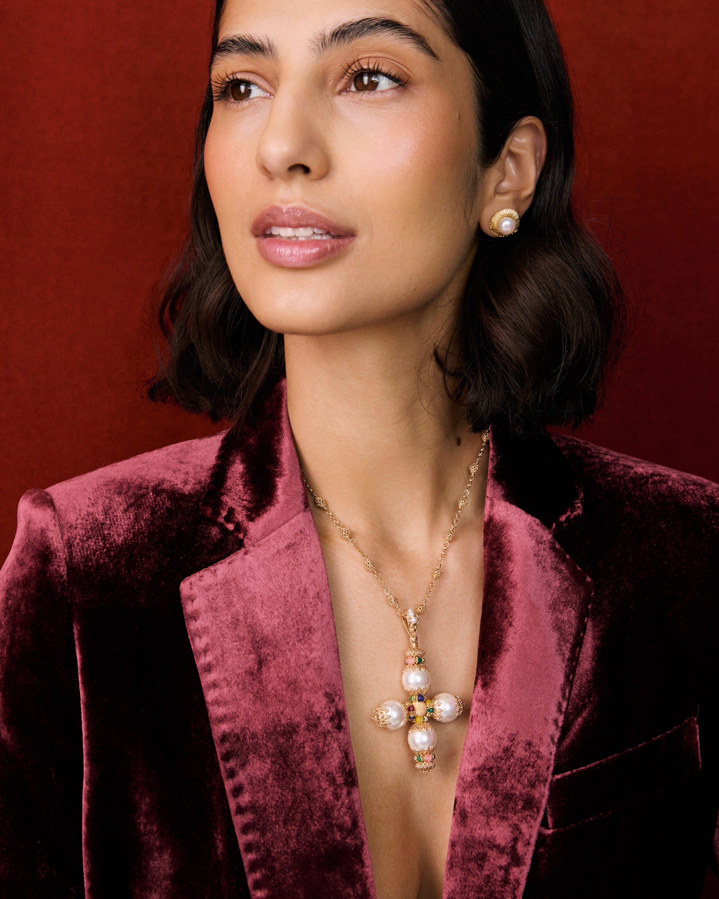 image of model wearing pearl cross necklace 