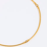 Gold necklace on a white background