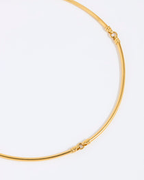 Gold necklace on a white background