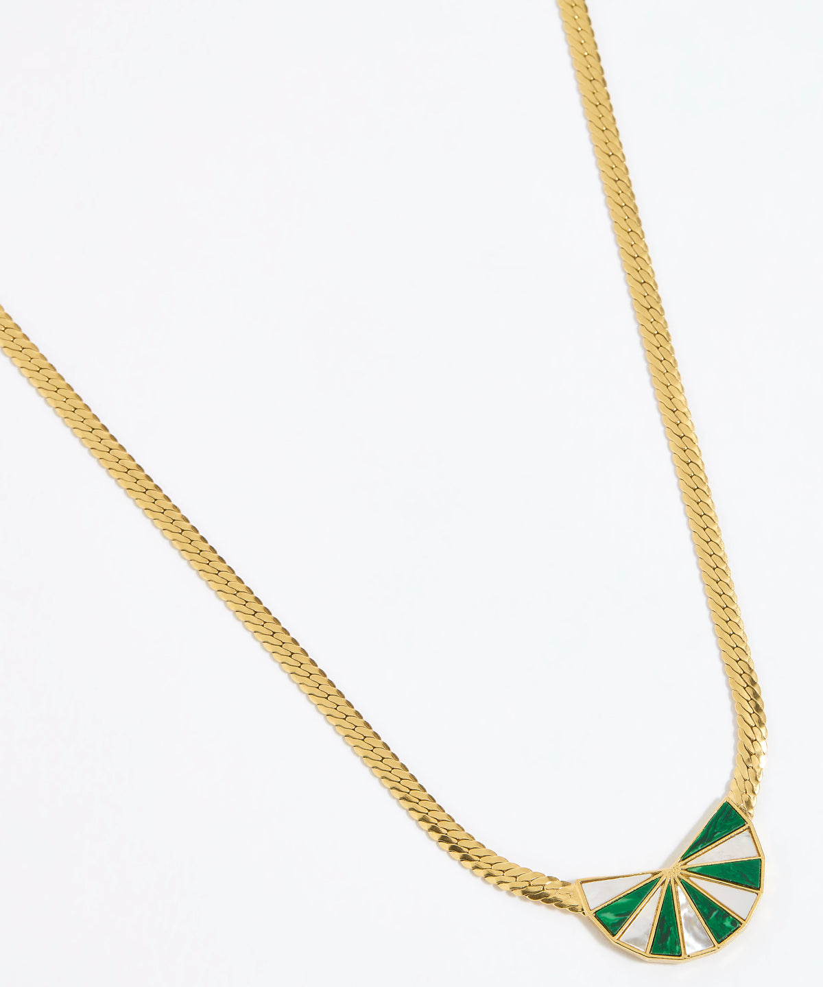 Gold necklace with a green and white fan shaped pendant on a white background