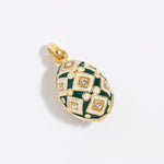 egg shaped Decorative charm pendant with green and gold design on a white background