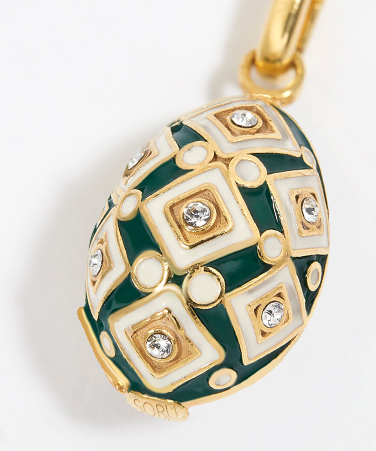 egg shaped Decorative charm pendant with green and gold design on a white background