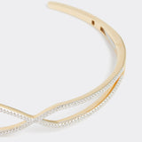 close up of geometric shaped gold and diamond bangle, product shot