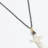 Pewter coloured beaded necklace with a white Baroque Pearl Cross pendant on a white background