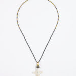 Pewter coloured beaded necklace with a white Baroque Pearl Cross pendant on a white background