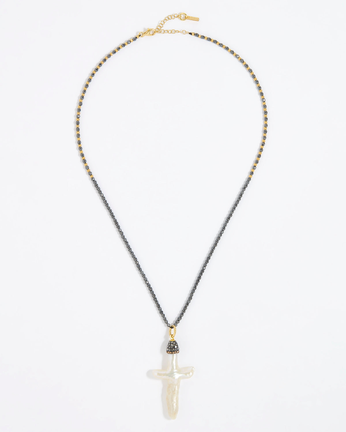 Pewter coloured beaded necklace with a white Baroque Pearl Cross pendant on a white background