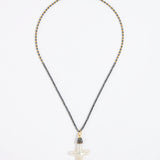 Pewter coloured beaded necklace with a white Baroque Pearl Cross pendant on a white background