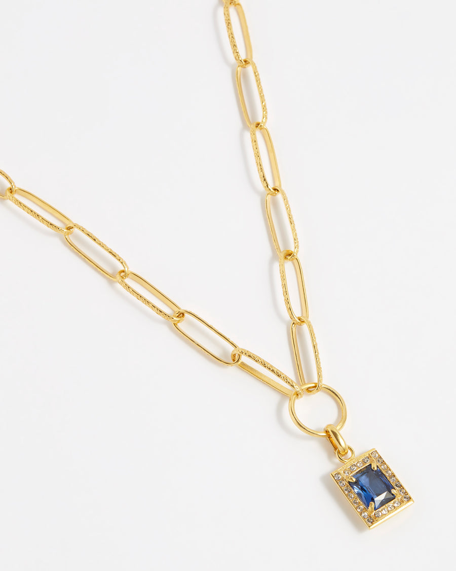 product shot of blue crystal square charm surrounded by clear crystals on the chain