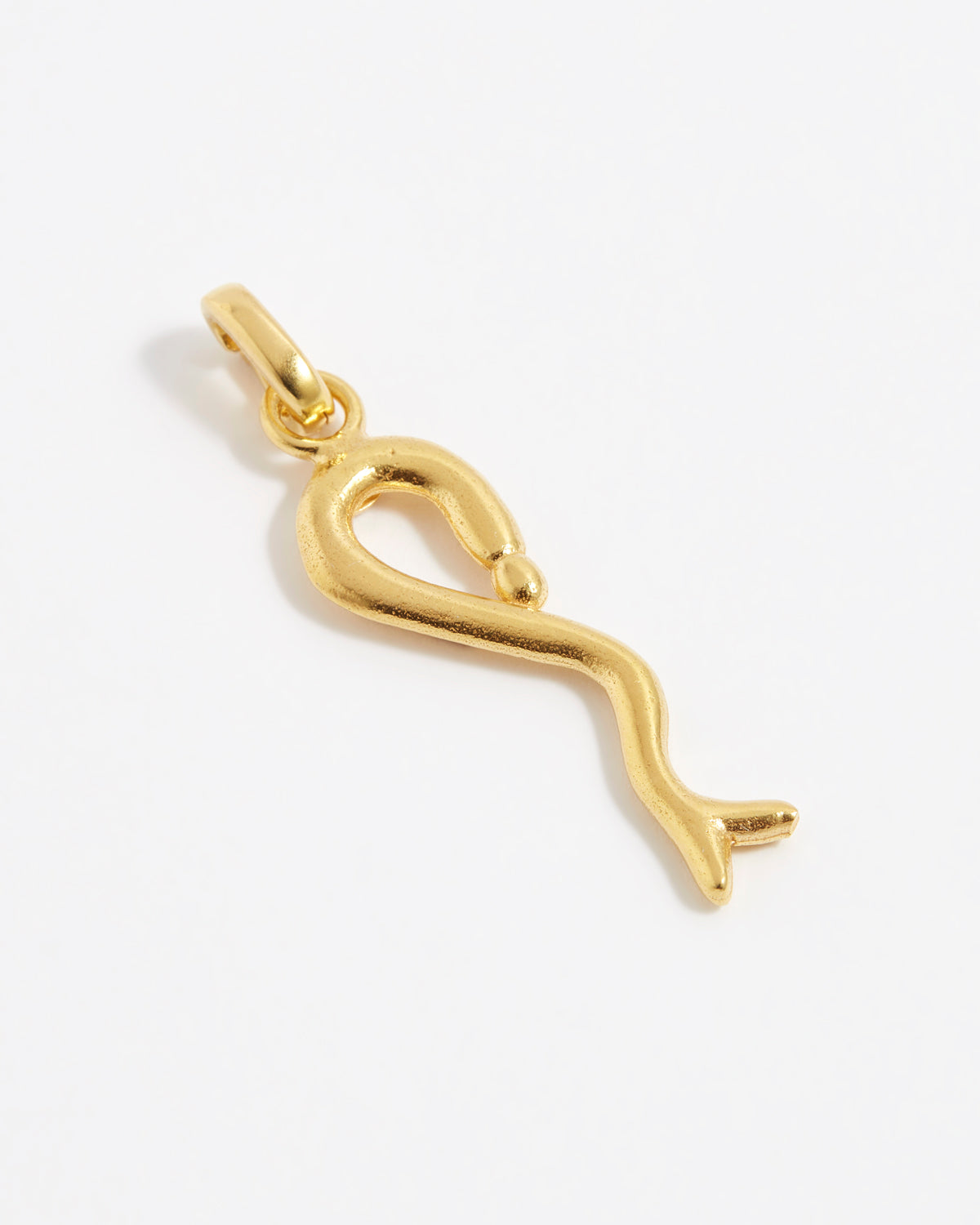 product shot of yellow gold plated snake charm