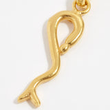 product shot of yellow gold plated snake charm close up