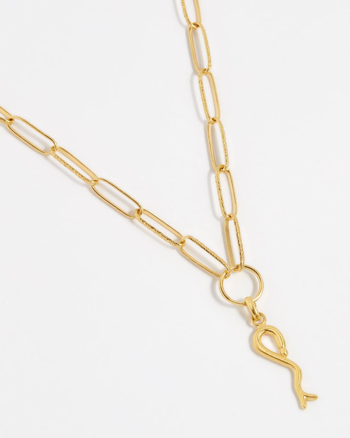 product shot of yellow gold plated snake charm on the chain