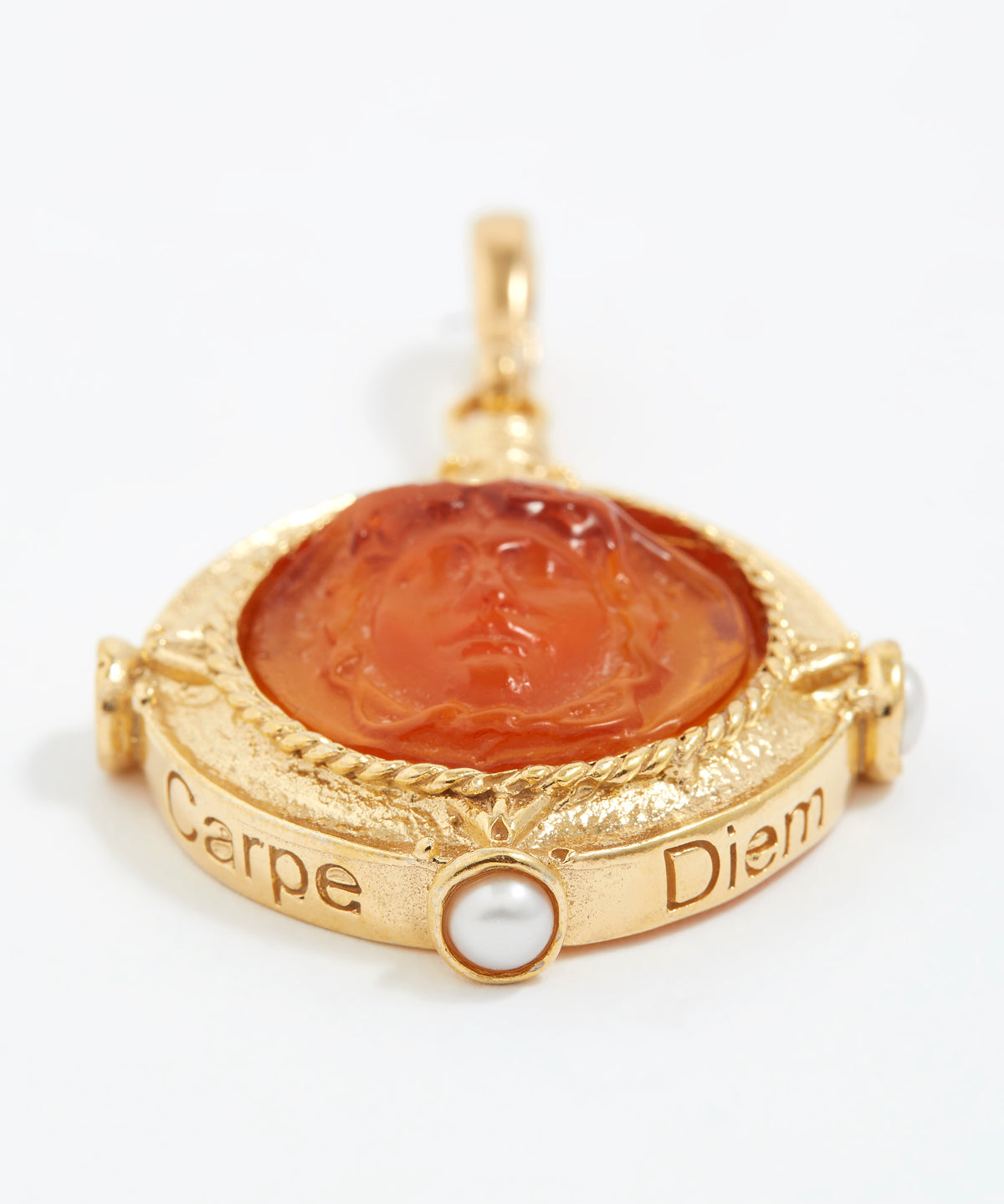 Gold pendant with a topaz stone and pearl on a white background