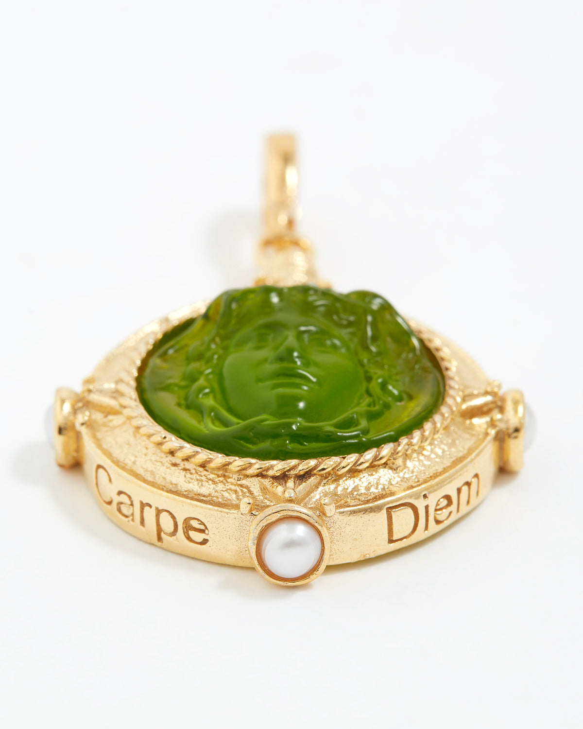Gold pendant with green stone and pearl on a white background