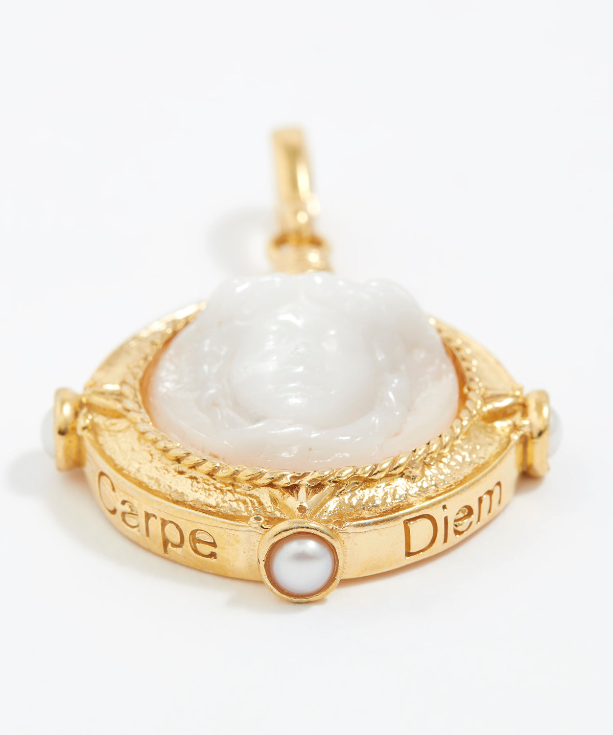 Gold pendant with a white stone and 'Carpe Diem' engraving on a white background