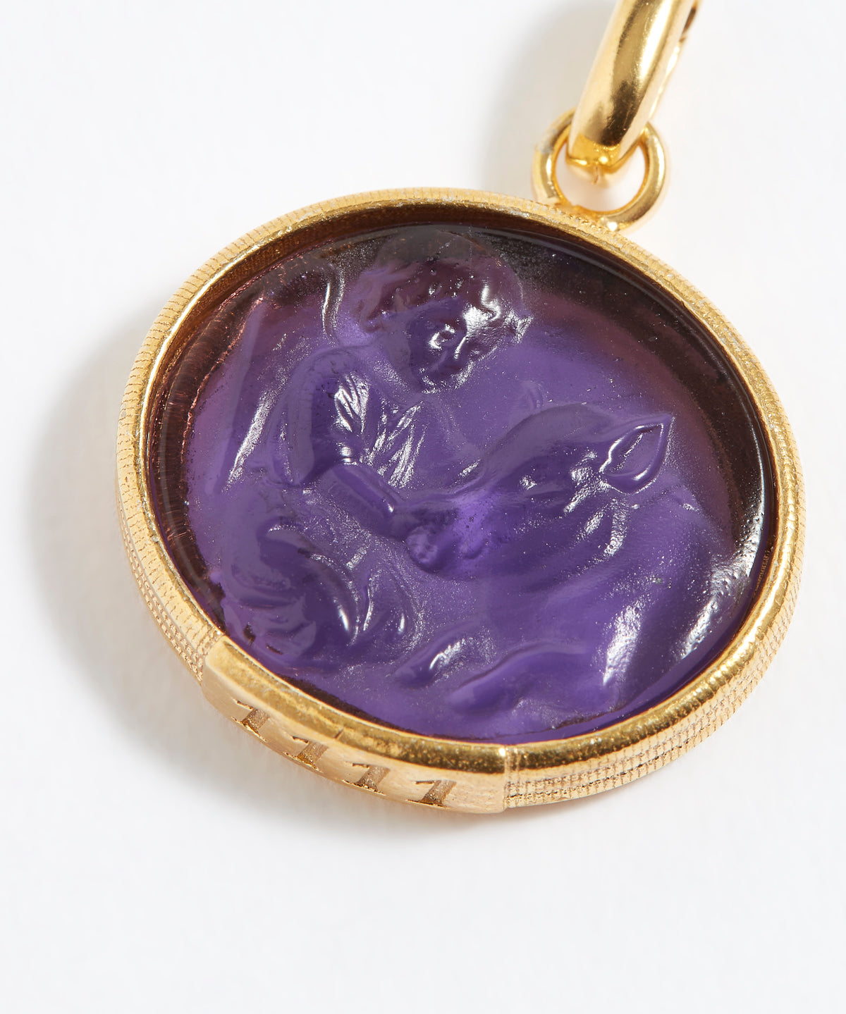 Purple stone pendant engraved with engraved angel numbers 1111 with gold setting on a white background