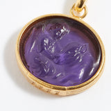 Purple stone pendant engraved with engraved angel numbers 1111 with gold setting on a white background