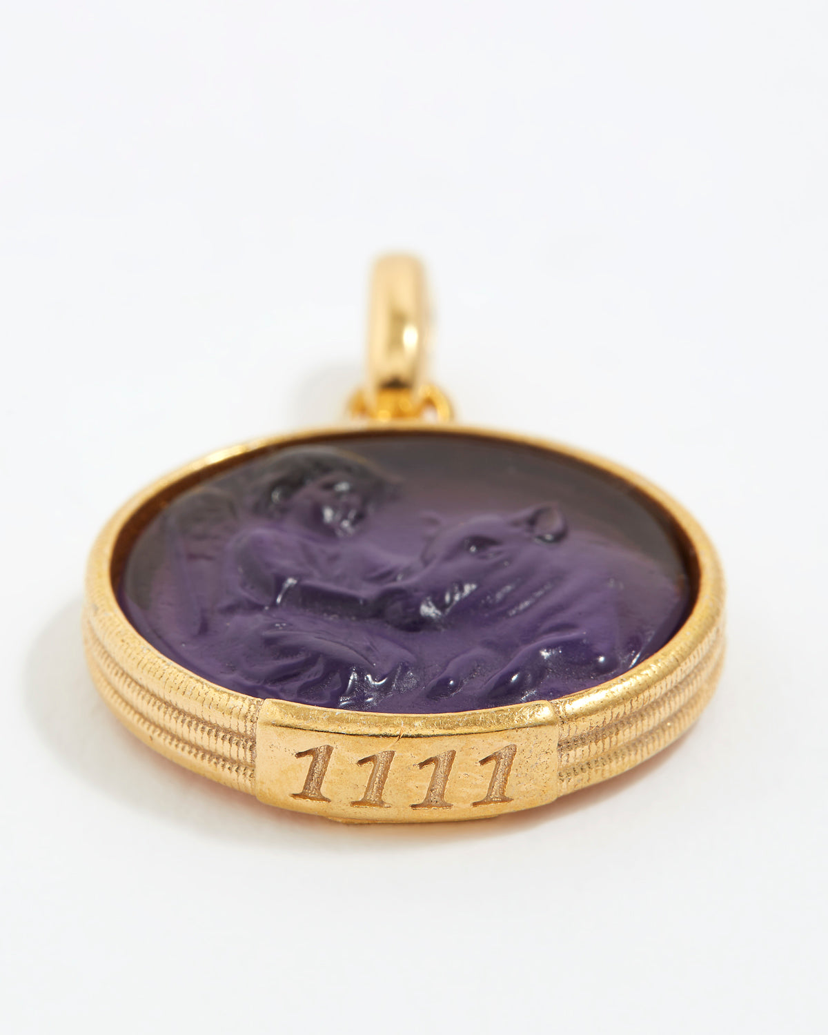 Gold pendant with purple stone and angel numbers 1111 engraving on a white background