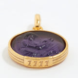 Gold pendant with purple stone and angel numbers 1111 engraving on a white background