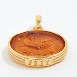 Gold pendant with a brown central design and angel number '1111' engraving on a white background