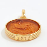 Gold pendant with a brown central design and angel number '1111' engraving on a white background