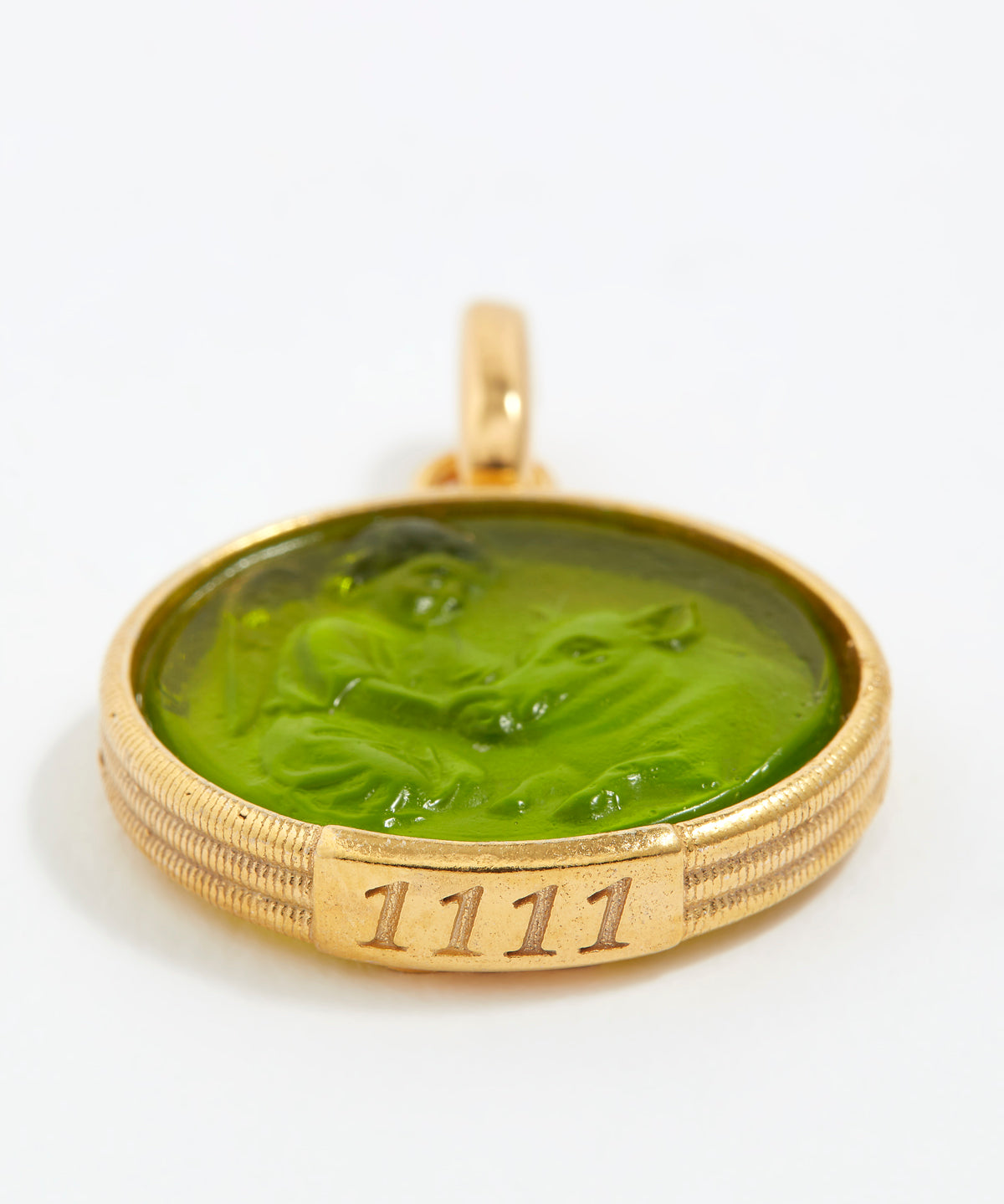 Gold pendant with green stone and engraved angel number '1111' on a white background