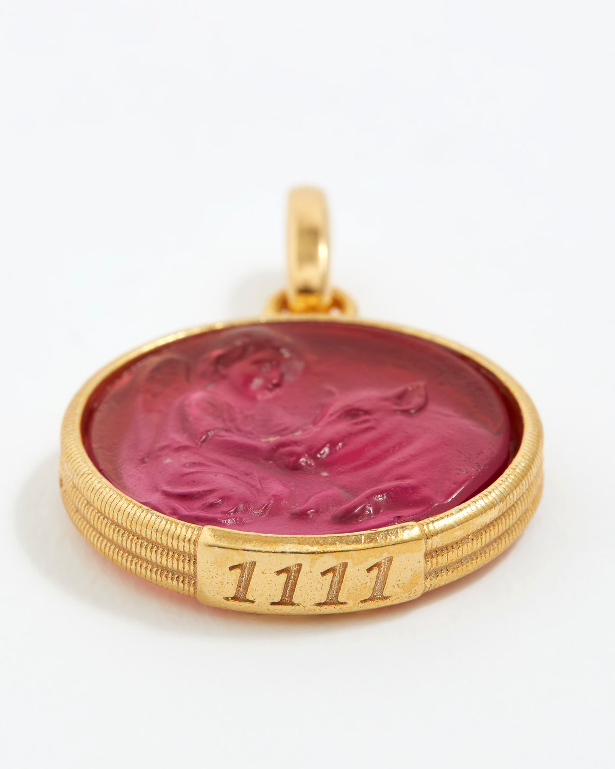 Gold pendant with a red stone and engraved angel numbers 1111 on a white background