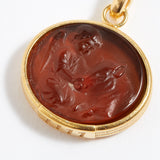 Gold pendant with a topaz stone featuring an engraved design angel numbers 1111 on a white background