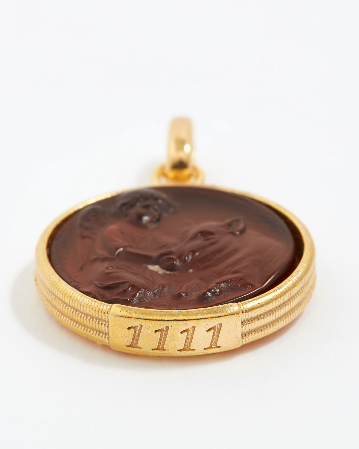 Gold pendant with a topaz stone and engraved angel numbers 1111 on a white background