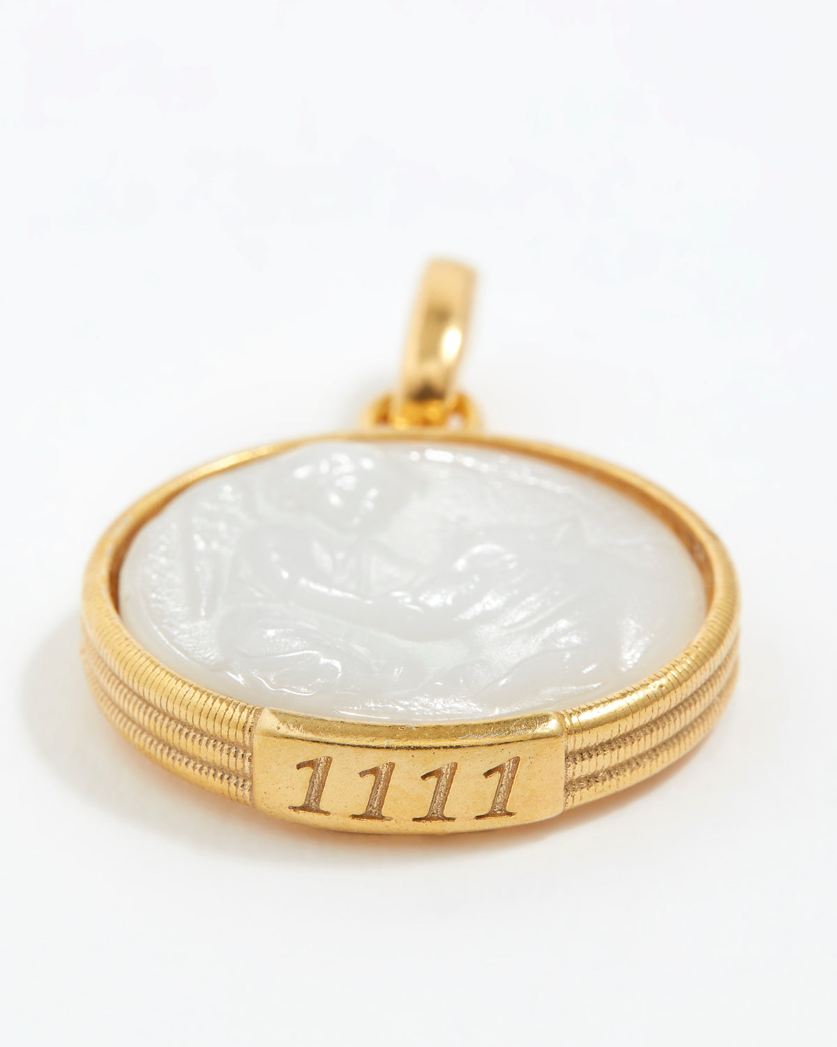 Gold pendant with a white stone and engraved angel numbers '1111' on a white background