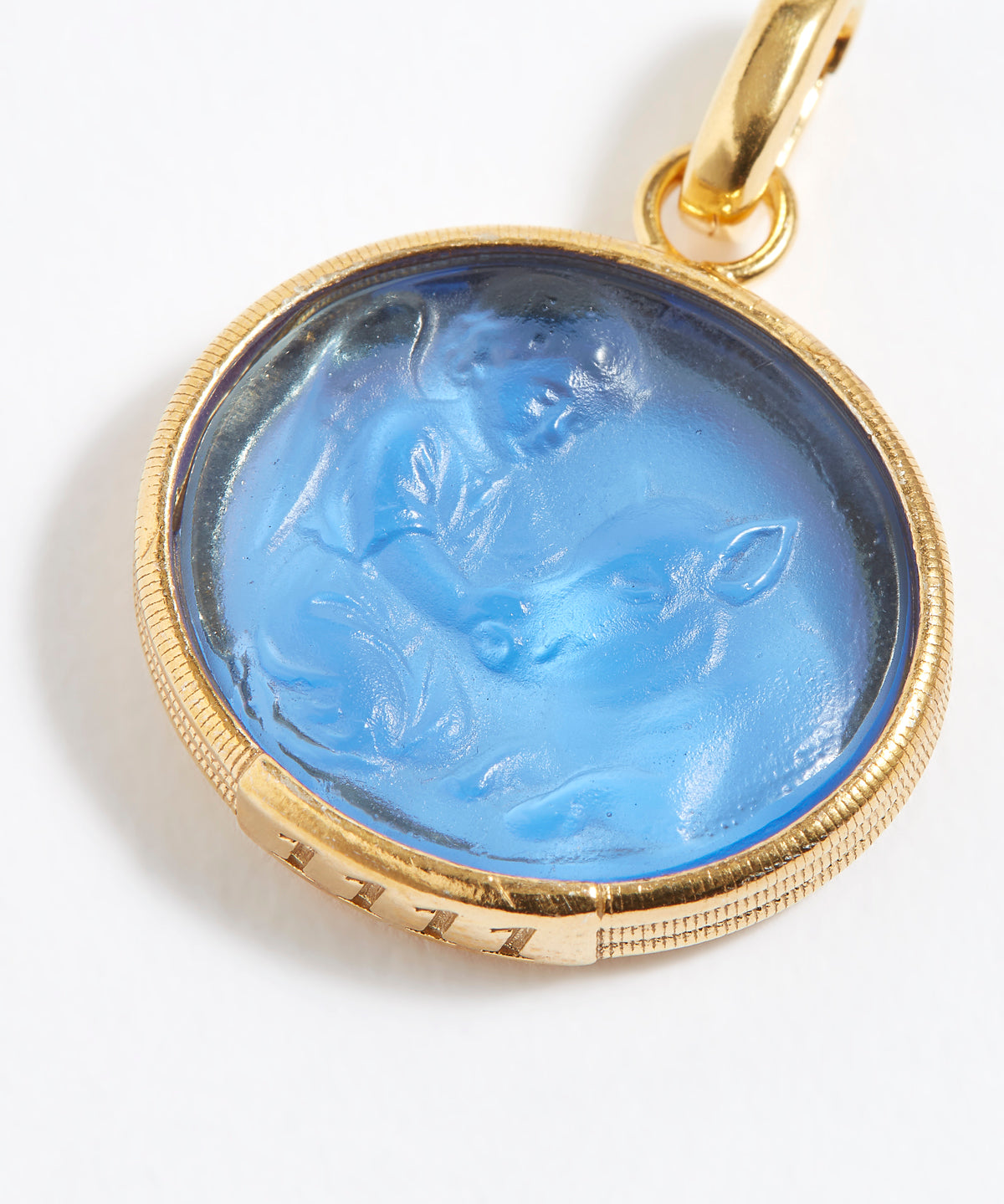 Gold pendant with blue stone featuring engraved engraved angel numbers 1111 on a white background