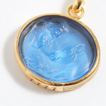 Gold pendant with blue stone featuring engraved engraved angel numbers 1111 on a white background