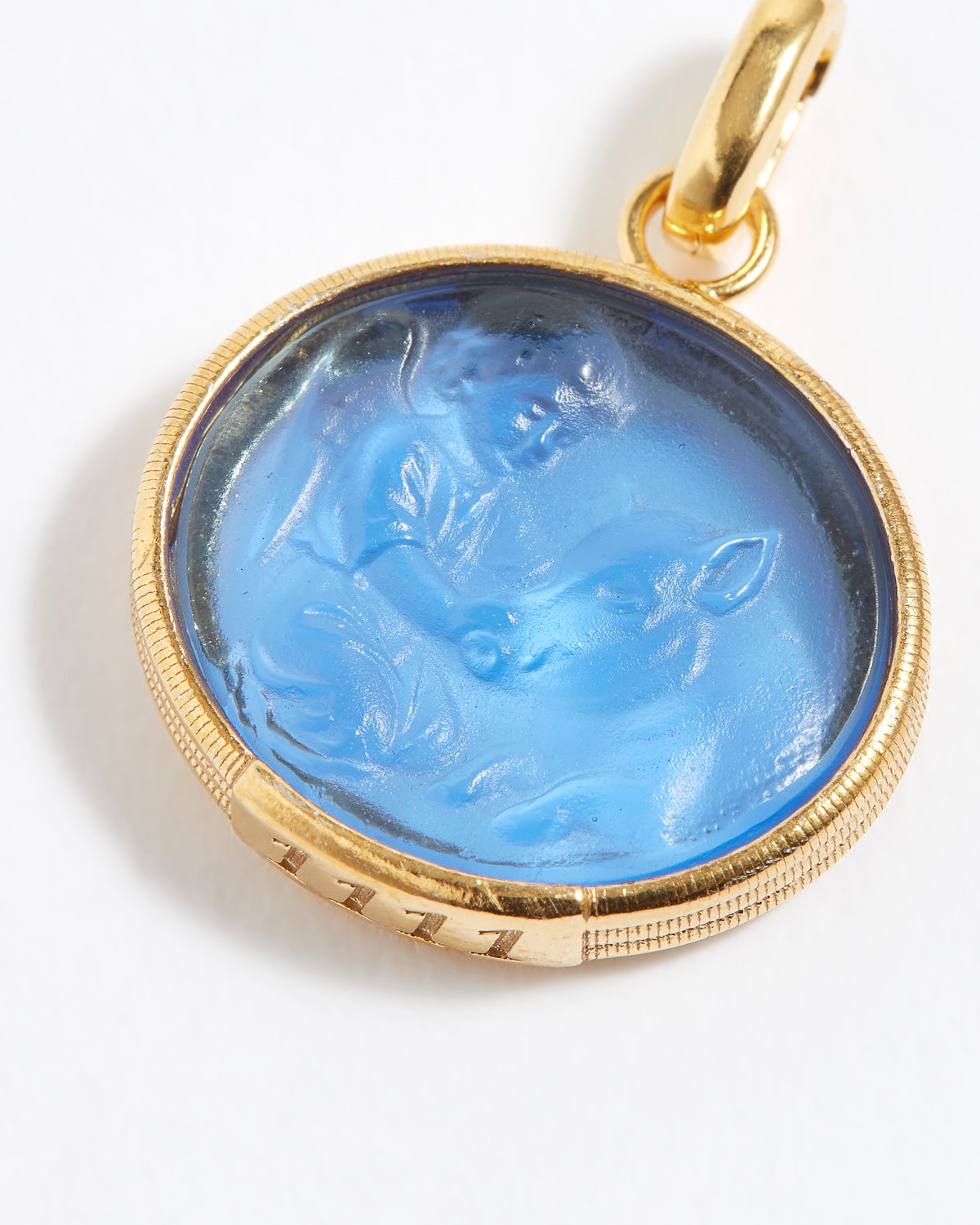 Gold pendant with blue stone featuring engraved engraved angel numbers 1111 on a white background