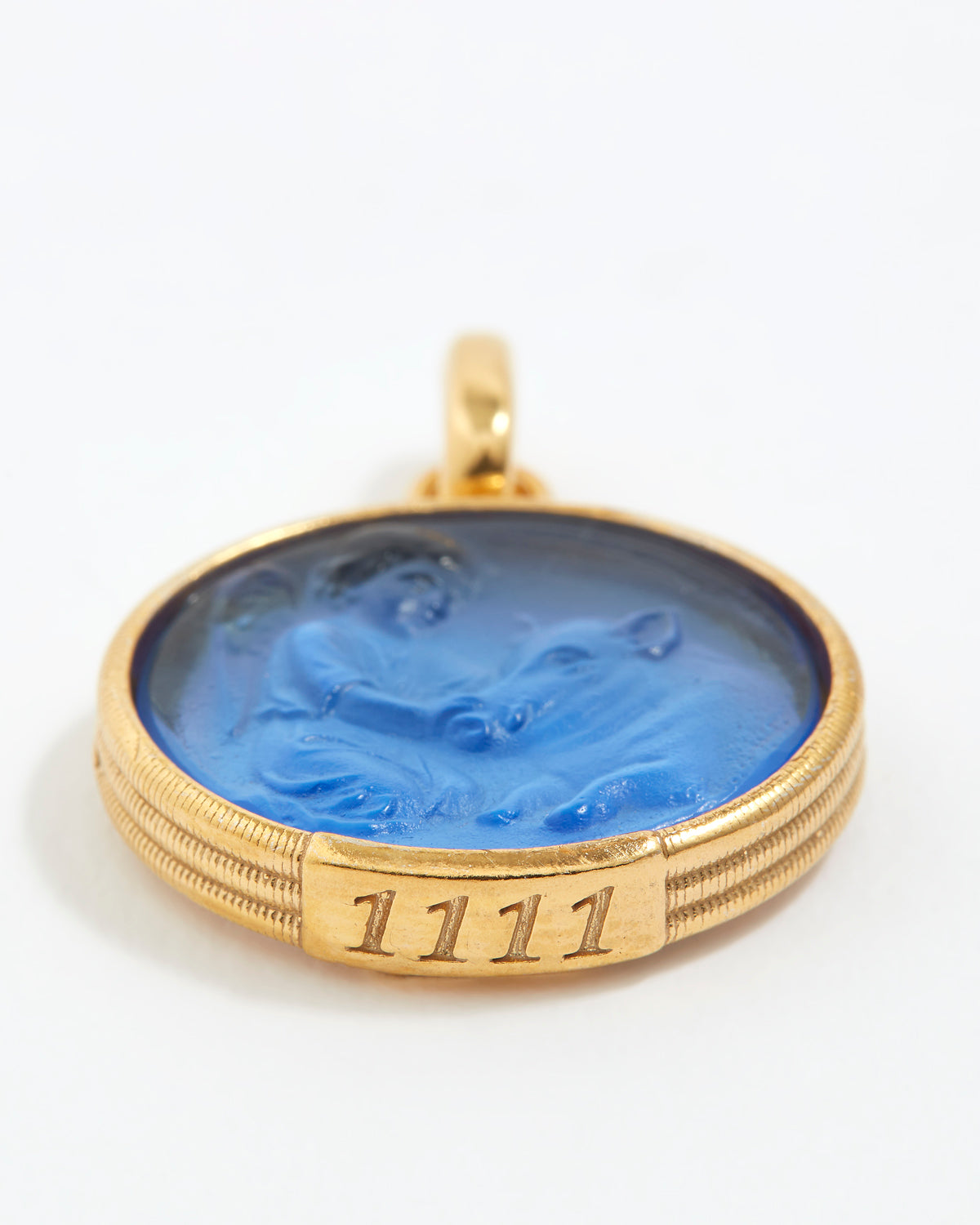 Gold pendant with blue stone and angel number '1111' engraving on a white background