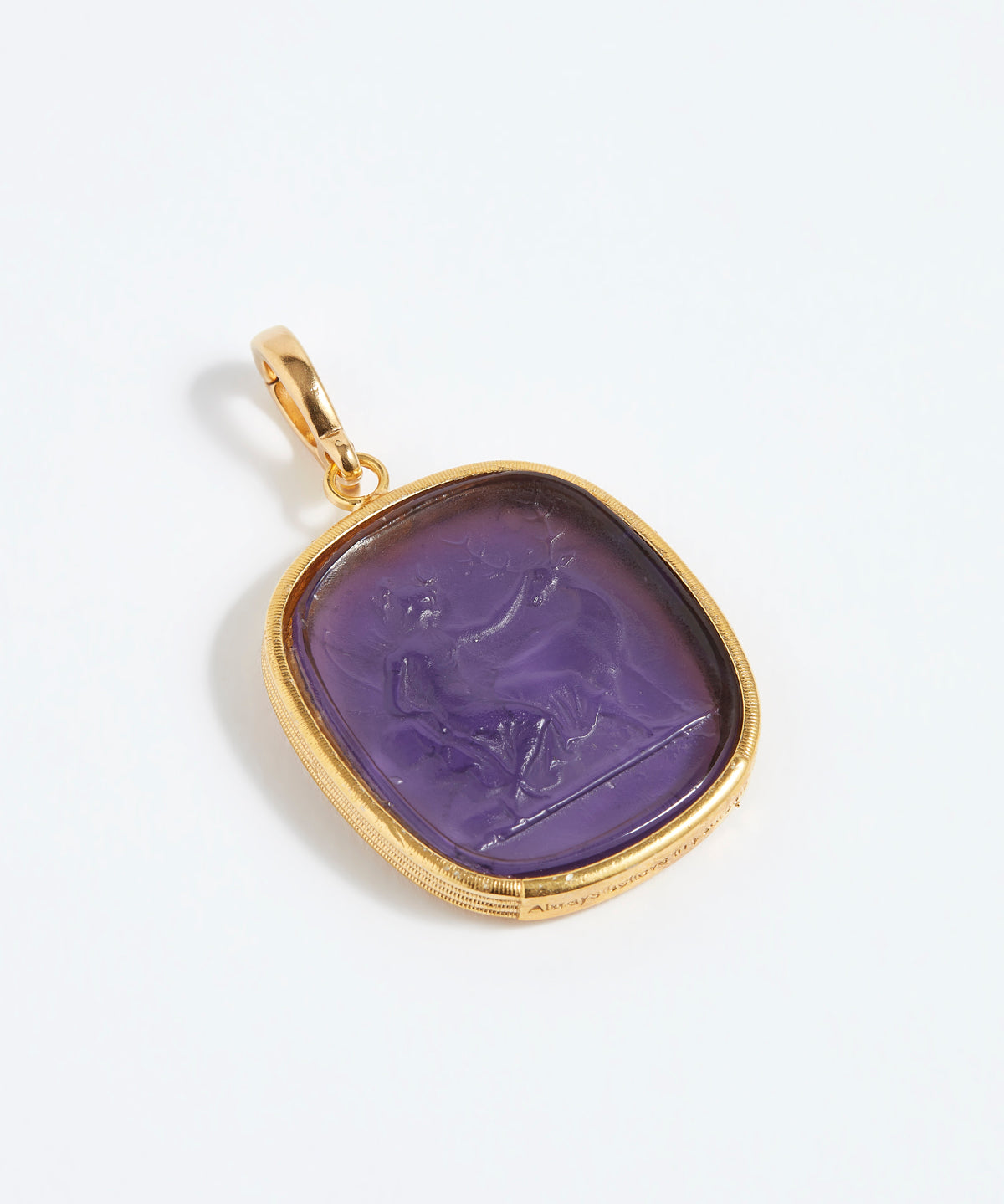 Purple stone pendant with gold frame on a white background